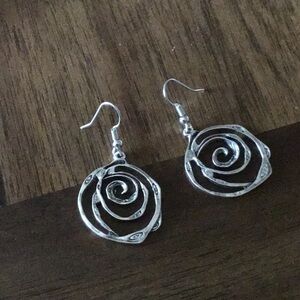 New silver in color dangle earrings